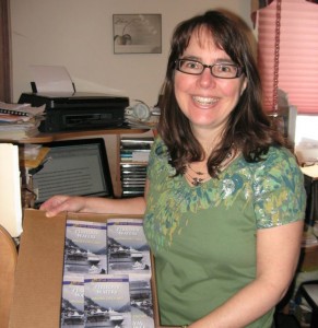 Sandra holding box of books