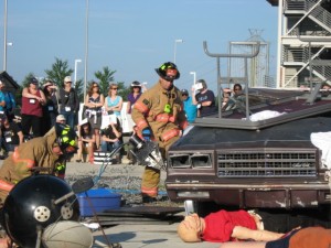 pic of firefighter raising car