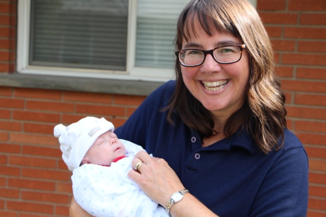 image of Sandra Orchard holding one of her grand babies