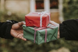 Friends exchanging gifts at a Christmas party