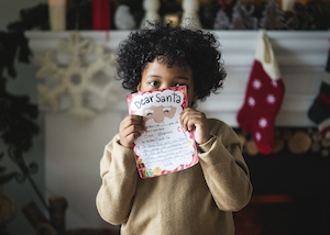 Child with Christmas wishlist